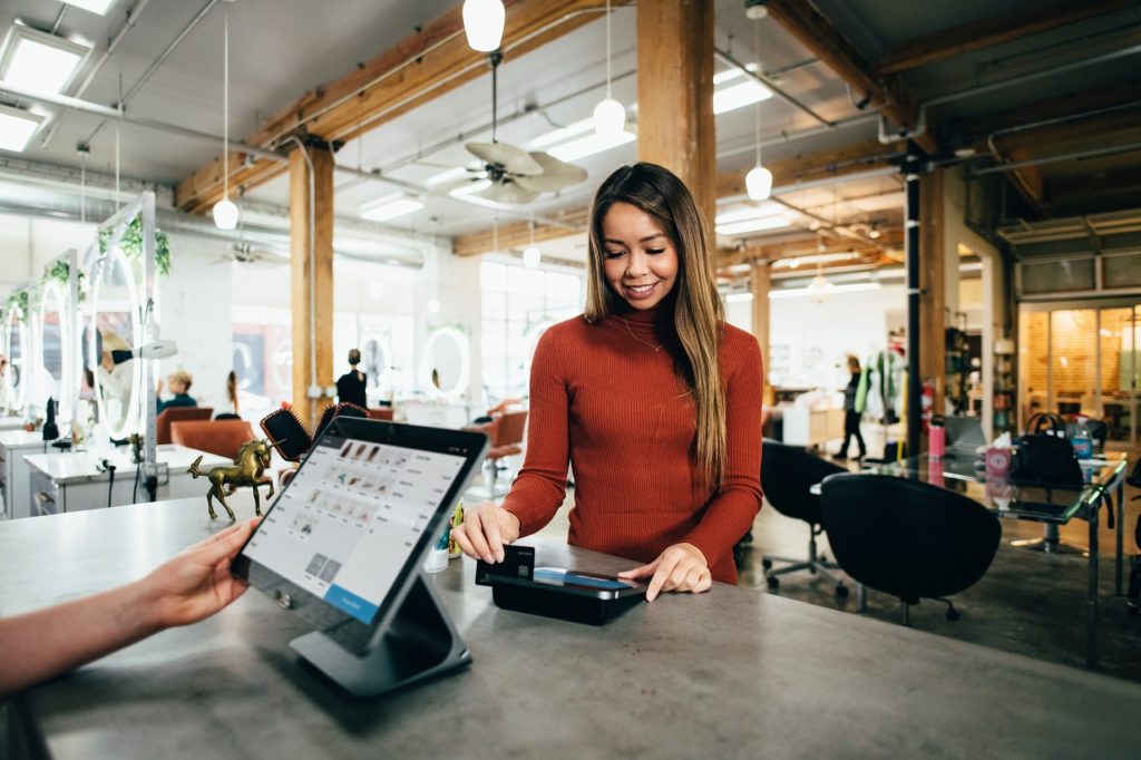 Someone making a purchase at one of the cannabis shops in New Brunswick