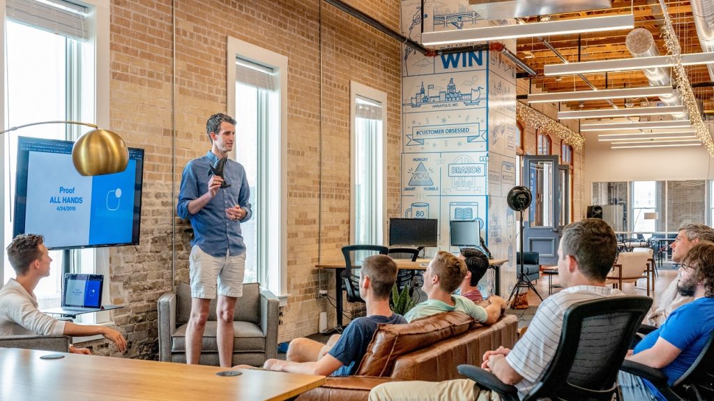 a classroom with a teacher, talking about cannabis startups in Brazil