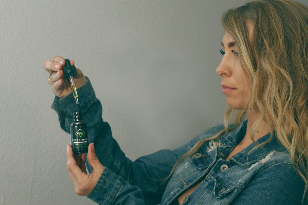 Woman with hemp product representing the European hemp extract company